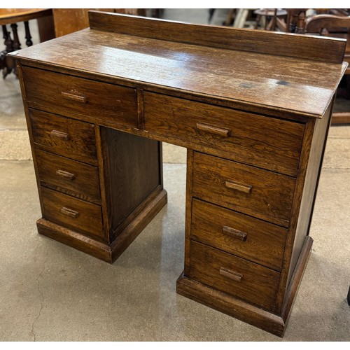 150 - An early 20th Century oak kneehole desk