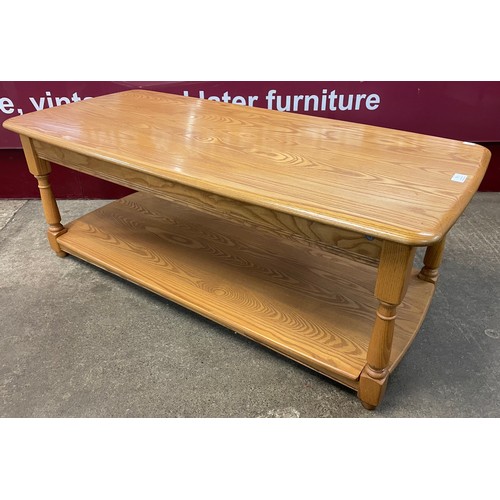 74 - An Ercol elm coffee table