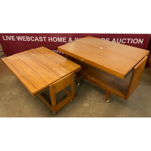 76 - Two simulated teak metamorphic trolleys/coffee tables