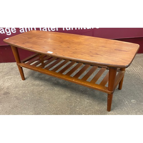 83 - A teak coffee table