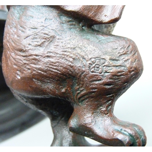 2015 - A pair of painted bronze wolf themed candlesticks