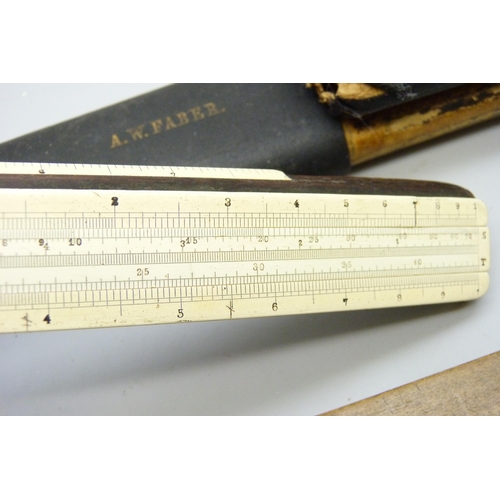 2017 - A slide rule and one other wooden ruler