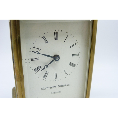 2020 - A Matthew Norman brass carriage clock with carry handle, no key, 11cm