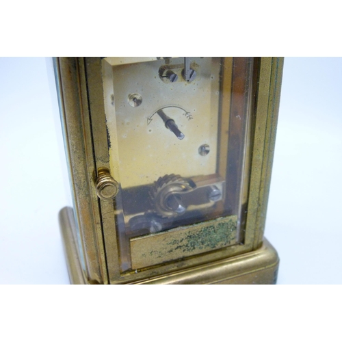 2020 - A Matthew Norman brass carriage clock with carry handle, no key, 11cm