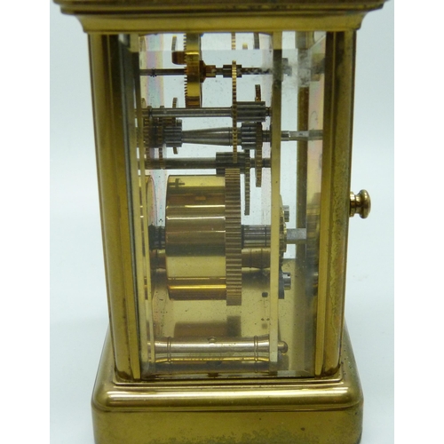 2020 - A Matthew Norman brass carriage clock with carry handle, no key, 11cm