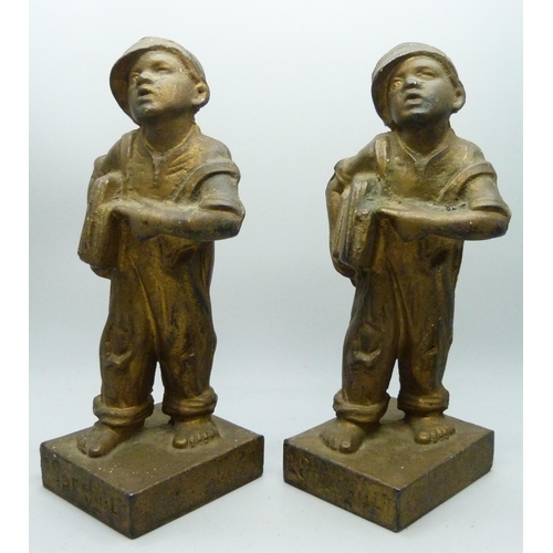 2031 - Two identical bronzed cast iron figures of News Boys, titled 'Speshul', 18cm