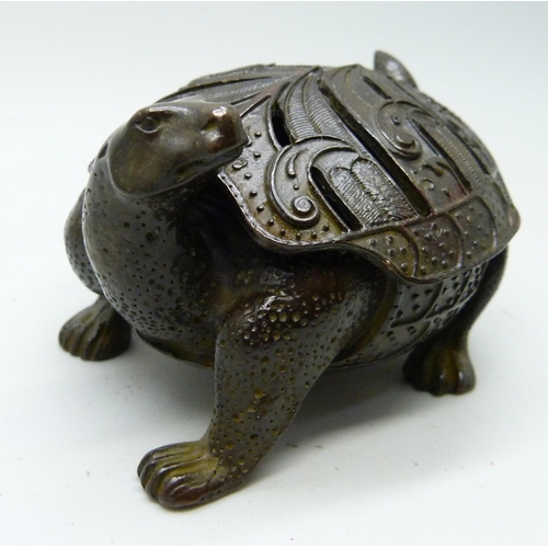 2032 - A Chinese bronze small tortoise figure with character mark to base