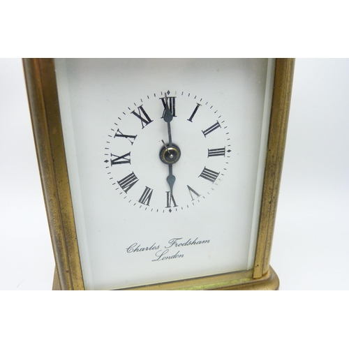 2035 - A Charles Frodsham brass and four glass sided carriage clock with striking movement, carry handle, t... 