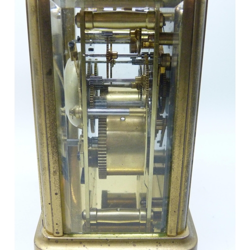 2035 - A Charles Frodsham brass and four glass sided carriage clock with striking movement, carry handle, t... 