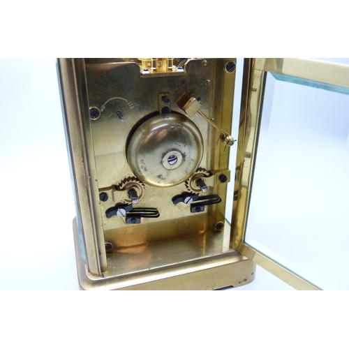 2035 - A Charles Frodsham brass and four glass sided carriage clock with striking movement, carry handle, t... 