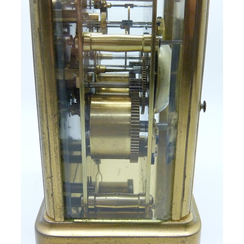 2035 - A Charles Frodsham brass and four glass sided carriage clock with striking movement, carry handle, t... 