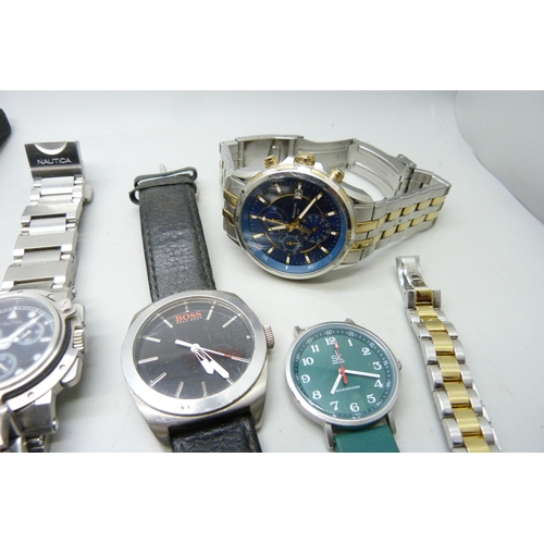 2058 - A collection of lady's and gentleman's wristwatches; Boss, Fossil, Citizen, Nautica, etc.