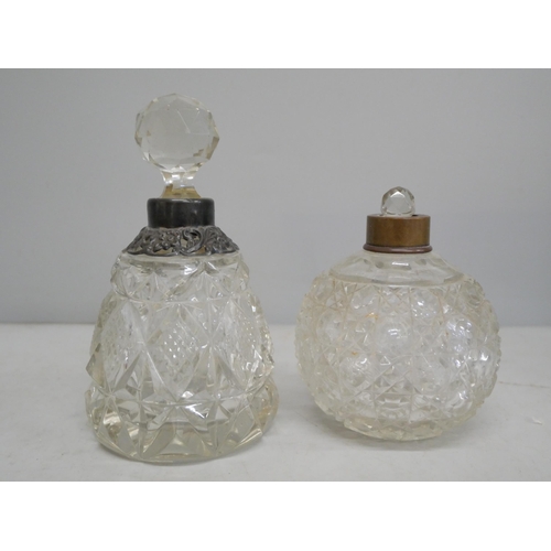 2097 - Two glass perfume bottles, one with silver collar, loose and stopper stuck, the other with stopper b... 