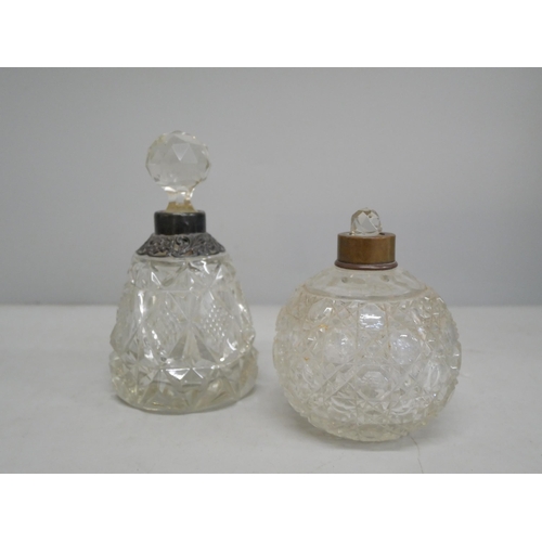 2097 - Two glass perfume bottles, one with silver collar, loose and stopper stuck, the other with stopper b... 