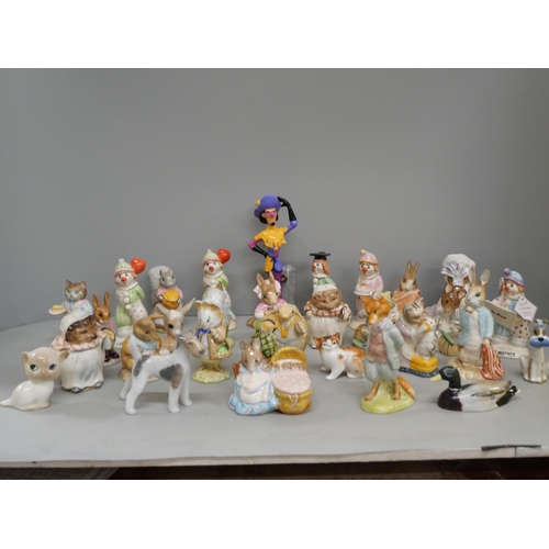 2102 - A collection of Beswick, Royal Doulton and Royal Albert Beatrix Potter Tales of Peter Rabbit figures... 