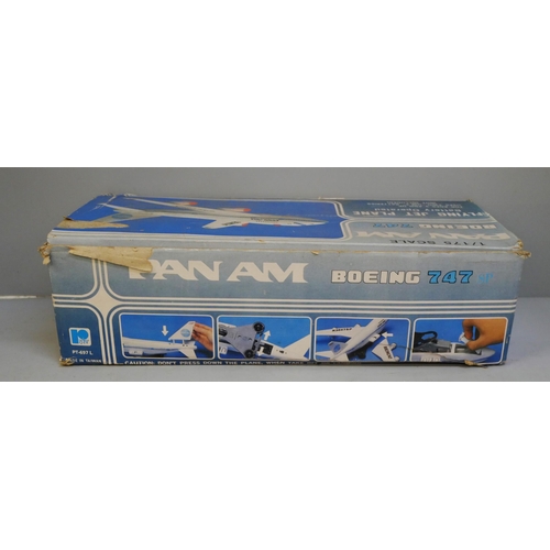 2125 - A collection of toys including Dinky trucks, a Pelham puppet, a pond yacht, Pan-Am Boeing 747, etc. ... 