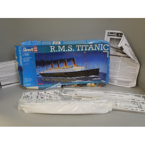 2134 - A box of model battleships and a Revell Titanic model kit