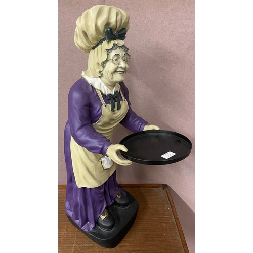 258 - A painted figural maid dumb waiter