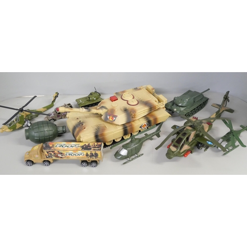 2157 - A collection of plastic toy soldiers, tank, aircraft and helicopters **PLEASE NOTE THIS LOT IS NOT E... 