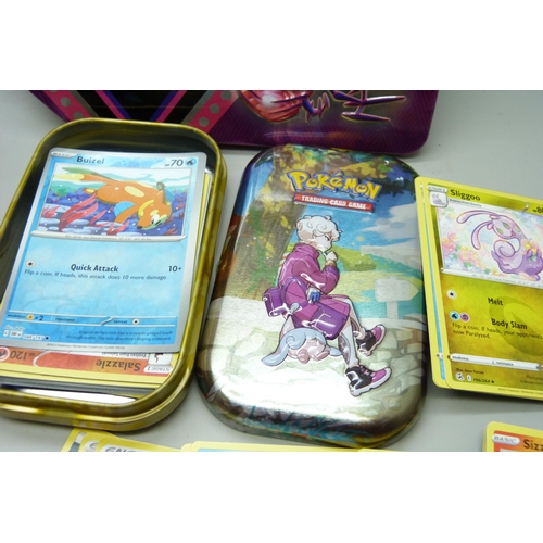 2188 - Over 600 Pokémon cards in two tins, contains holos