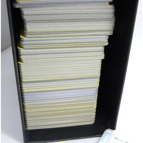 2190 - Over 600 Pokémon cards in collectors box and tin, contains a variety of holographic including rares