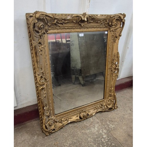 293 - A Victorian style gilt gesso framed mirror