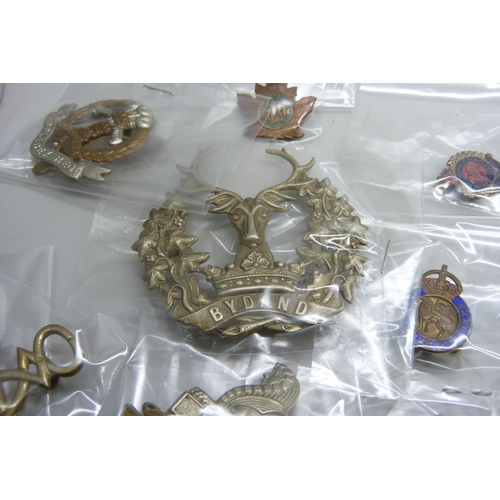 2222 - A collection of regimental pin badges including Royal Dublin Fusiliers, The Royal Scots, Royal Corps... 