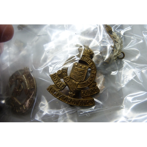 2222 - A collection of regimental pin badges including Royal Dublin Fusiliers, The Royal Scots, Royal Corps... 