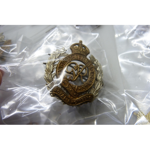 2222 - A collection of regimental pin badges including Royal Dublin Fusiliers, The Royal Scots, Royal Corps... 