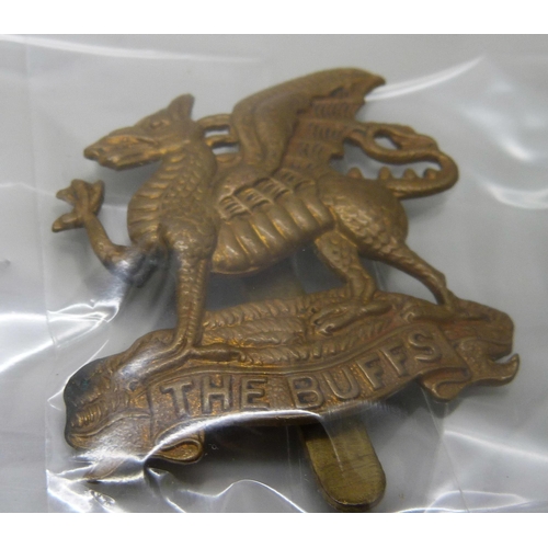 2222 - A collection of regimental pin badges including Royal Dublin Fusiliers, The Royal Scots, Royal Corps... 