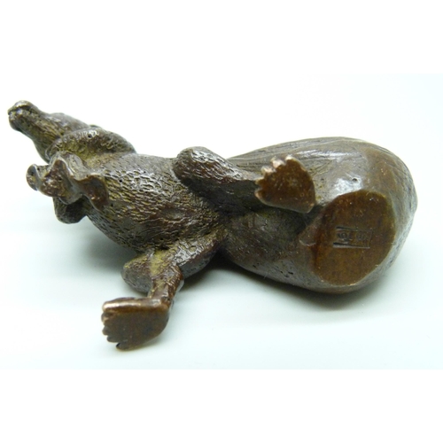 2229 - An oriental small bronze rat with sack