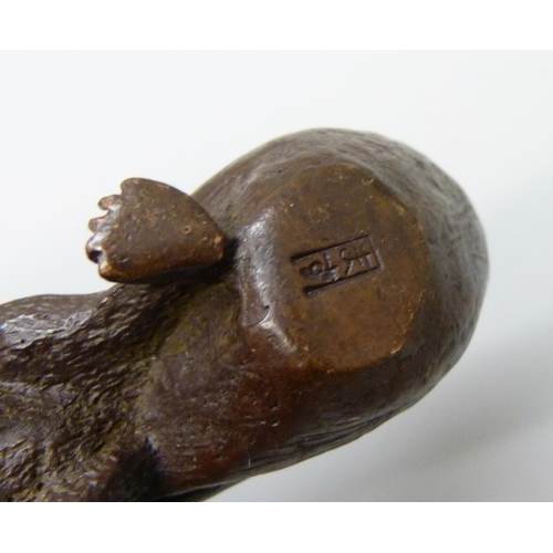 2229 - An oriental small bronze rat with sack