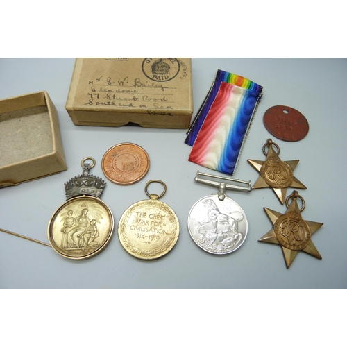 2233 - A Masonic Honorable Testimonial Medal with 15ct gold mount, inscribed, a WWI Victory medal to A-Sgt ... 