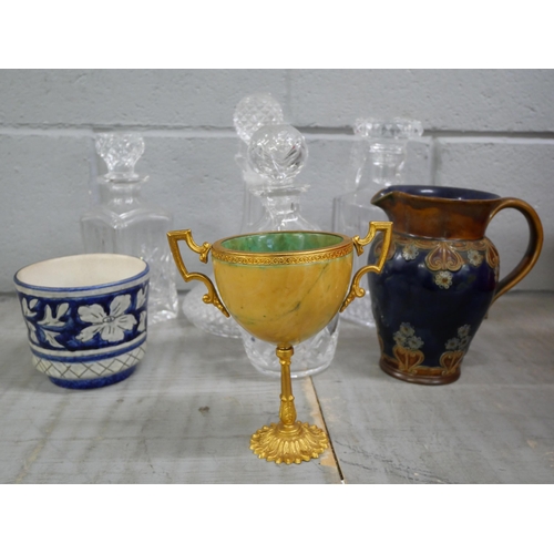 2308 - A Royal Doulton jug, a gilt metal two handled urn, four glass decanters and a planter **PLEASE NOTE ... 