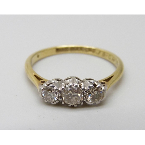 7007 - An 18ct gold diamond trilogy ring, 2.1g, L