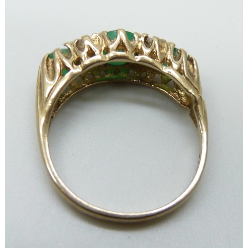 7009 - A 9ct gold, emerald and white stone ring, 3.6g, P