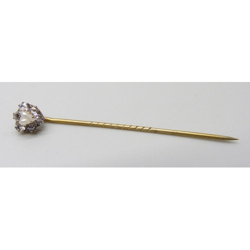 7017 - A yellow metal stick pin with white stones and heart shaped pearl, cased, 1g