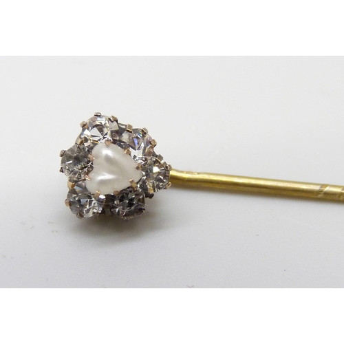 7017 - A yellow metal stick pin with white stones and heart shaped pearl, cased, 1g