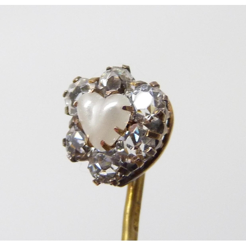 7017 - A yellow metal stick pin with white stones and heart shaped pearl, cased, 1g