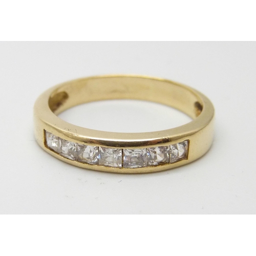 7024 - A yellow metal and princess cut zircon ring, marked on the outside of the shank including 18K, 3.2g,... 