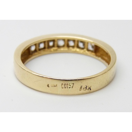 7024 - A yellow metal and princess cut zircon ring, marked on the outside of the shank including 18K, 3.2g,... 