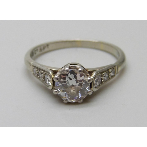 7032 - An Art Deco 18ct gold and platinum set seven stone diamond ring, main stone approximately 0.75 carat... 