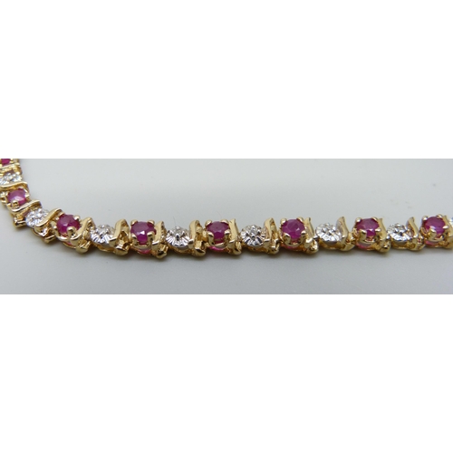 7033 - A 9ct gold, ruby and diamond bracelet, 7.3g, 19.5cm