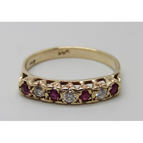 7034 - A 14ct gold, ruby and diamond ring, marked 585, 2.6g, S