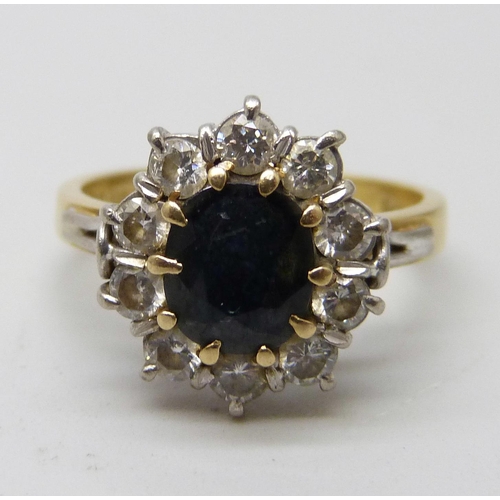 7046 - An 18ct gold, sapphire and diamond ring, 4.6g, L