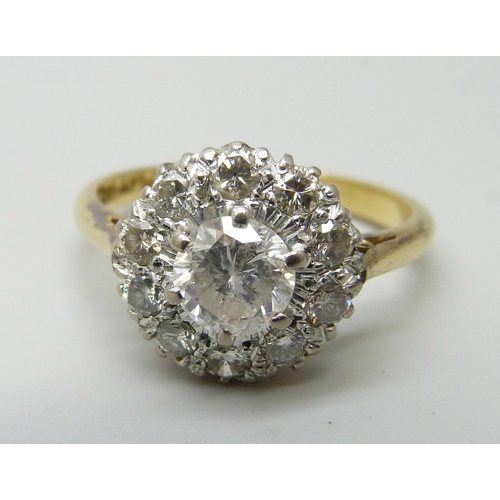 7052 - An 18ct gold and diamond ring, main stone approximately 0.75 carat weight, 4.2g, P