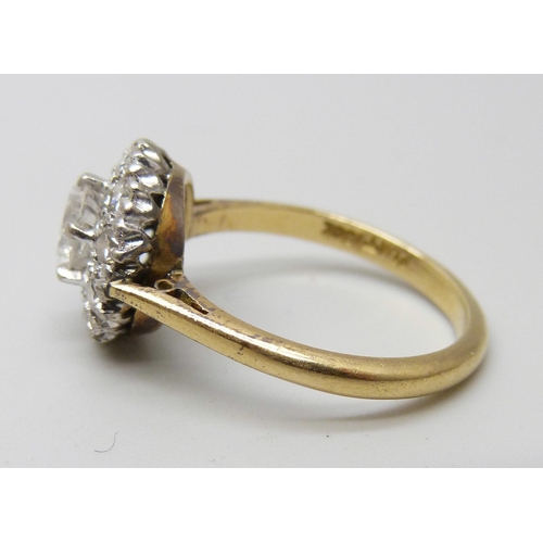 7052 - An 18ct gold and diamond ring, main stone approximately 0.75 carat weight, 4.2g, P