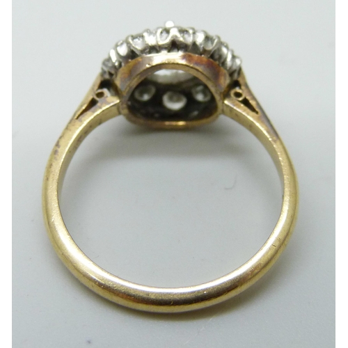 7052 - An 18ct gold and diamond ring, main stone approximately 0.75 carat weight, 4.2g, P