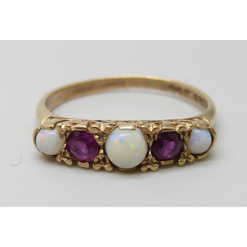 7053 - A 9ct gold, Victorian style opal and ruby ring, 2.2g, P