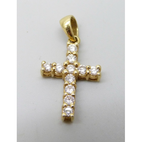 7056 - An 18ct gold and diamond set cross pendant, 1.9g, 12mm wide